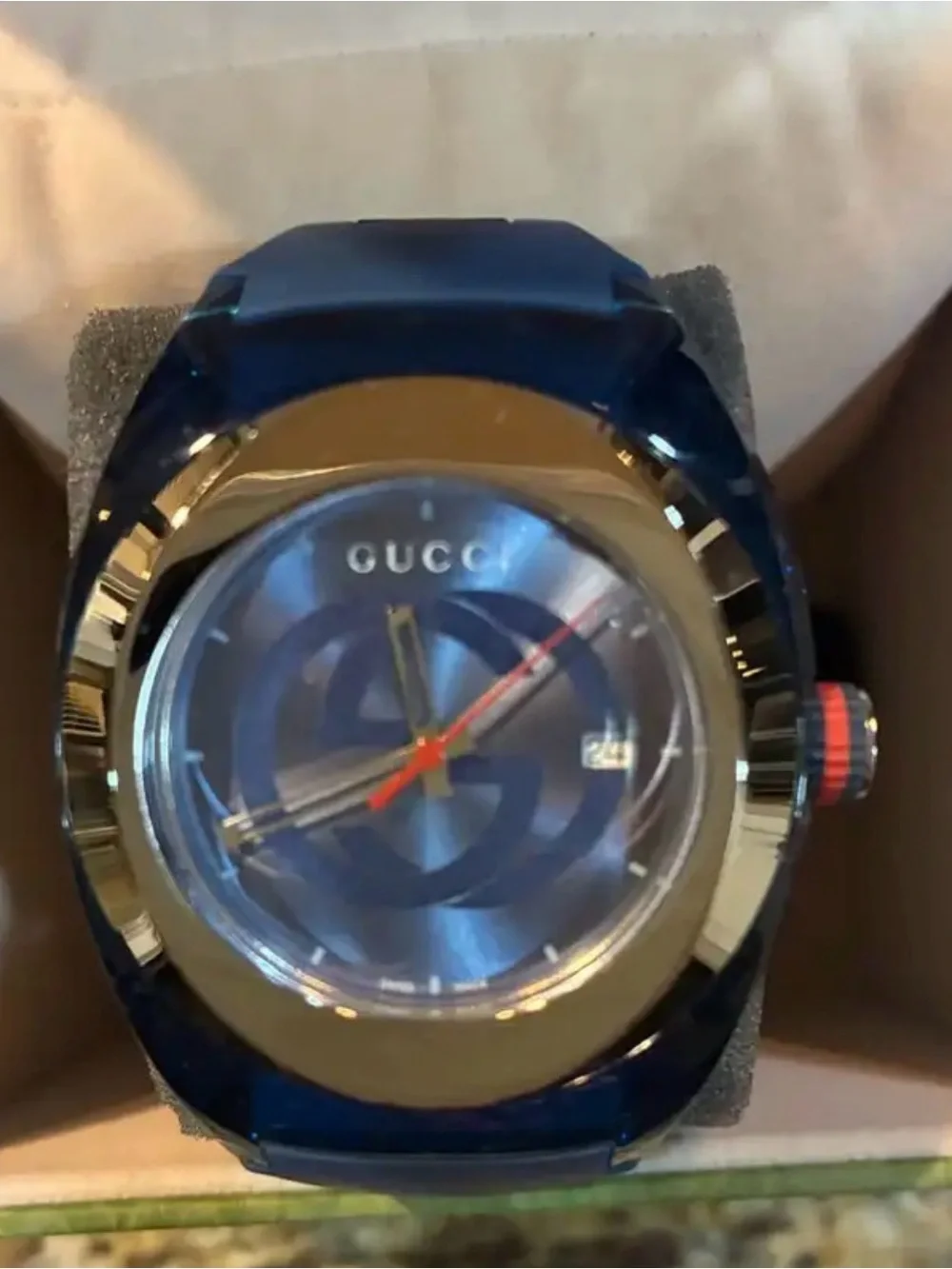 Gucci Men’s Blue Dial Watch with Gold Bezel and Red Accent